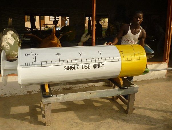 This big fat syringe casket for a Ghanaian nurse.