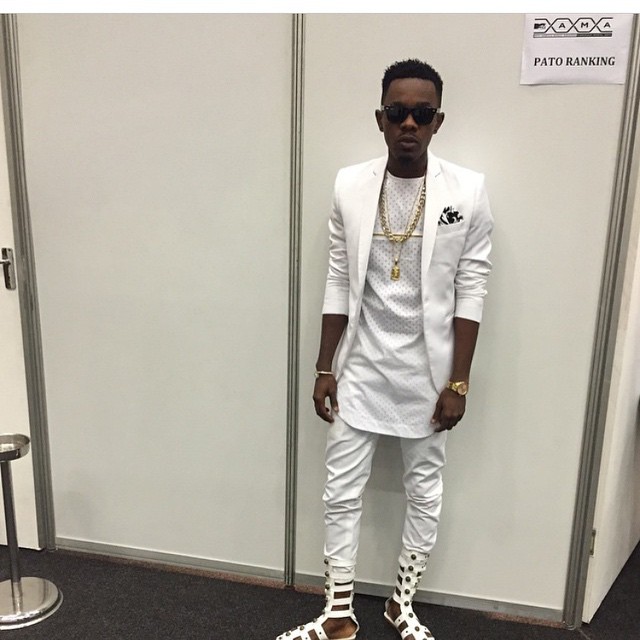 Patoranking fashion fail in white outfit and gladiators